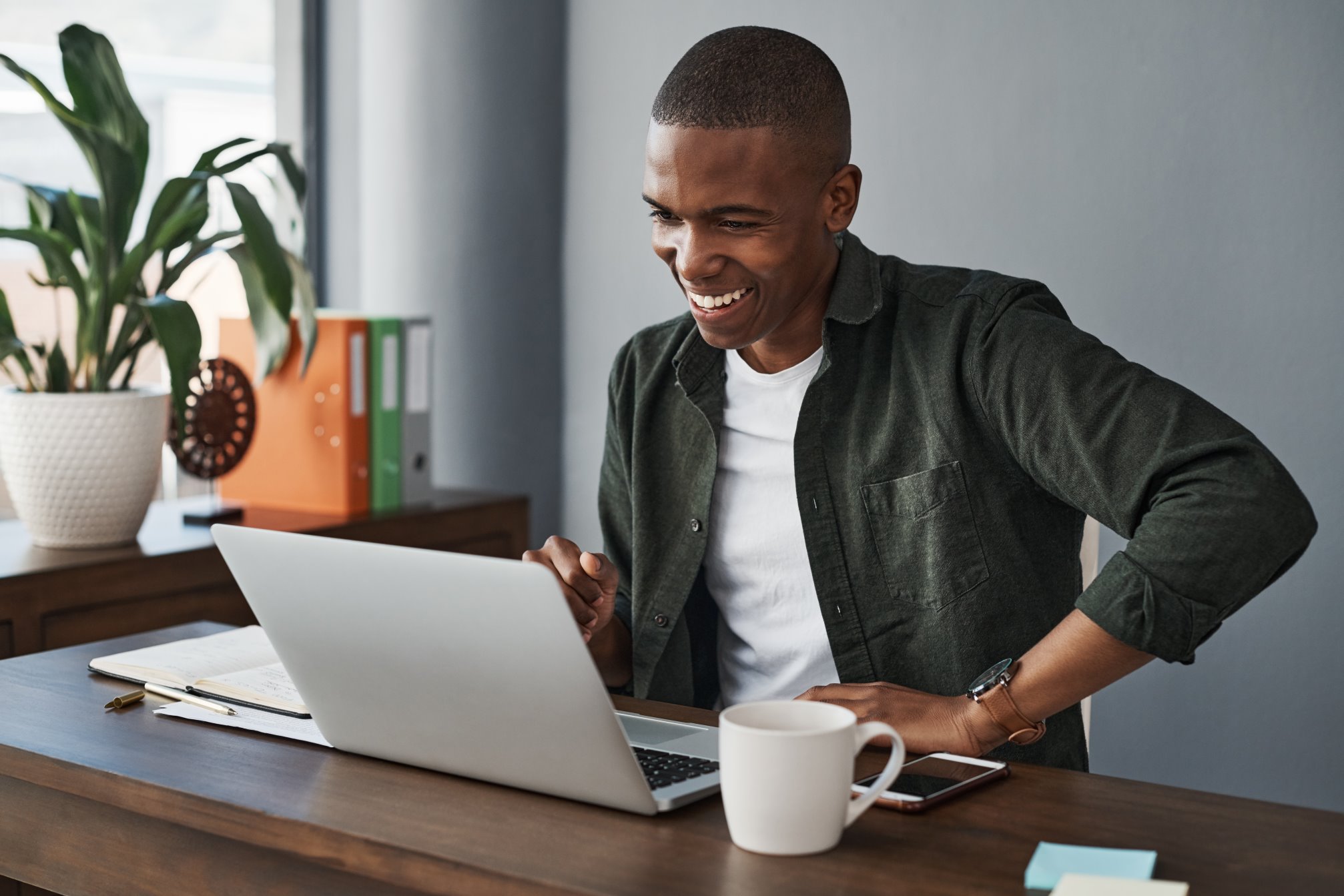 Person smiling with laptop